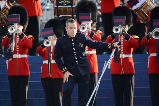 British singer-songwriter Robbie Williams performs on stage during the Queen's Diamond Jubilee Concert at Buckingham Palace in London. Queen Elizabeth II smiled as she took her place for a star-studded diamond jubilee concert Monday, despite her husband's sudden hospitalisation. (AFP Photo/Leon Neal) British singer-songwriter Robbie Williams performs on stage during the Queen's Diamond Jubilee Concert at Buckingham Palace in London. Queen Elizabeth II smiled as she took her place for a star-studded diamond jubilee concert Monday, despite her husband's sudden hospitalisation. (AFP Photo/Leon Neal)