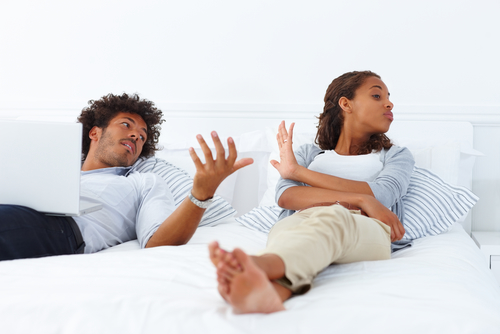 couple-in-bed-arguing