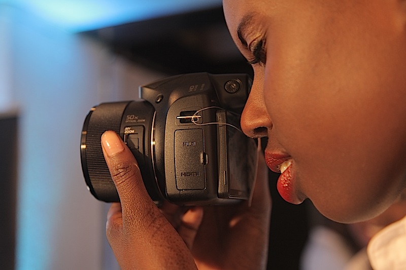 A model tests the Sony HX300 camera during its launch in Nairobi in May 2013