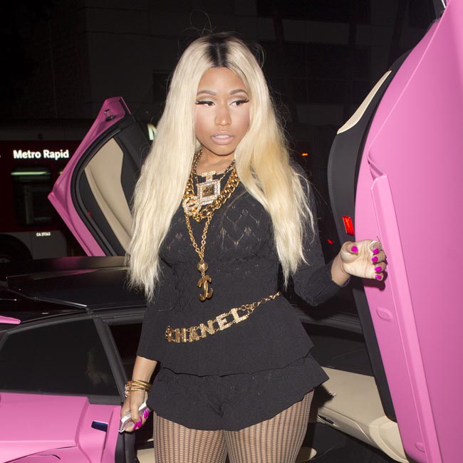 Nicki Minaj seen arriving at for her 31st birthday party "Philippe" Restaurant in Beverly Hills in her custom  $700,000 Pink Lamborghini Aventador sports car.
