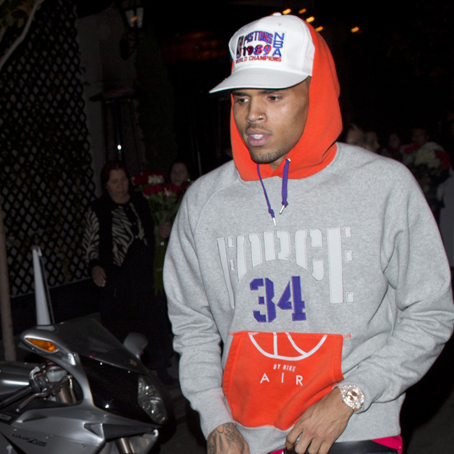 Chris Brown wasted no time after turning himself in for a short Jail stint today as he was seen leaving 'AV nightlcub' with a Mystery Blonde girl in Hollywood, CA