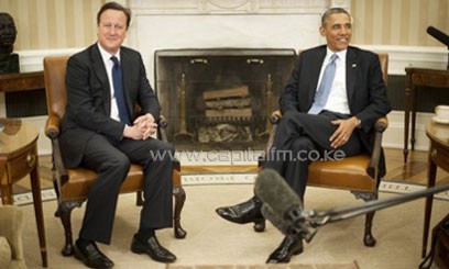 US President Barack Obama (R) and British Prime Minister David Cameron meet in the Oval Office of the White House in Washington, DC, May 13, 2013/AFP