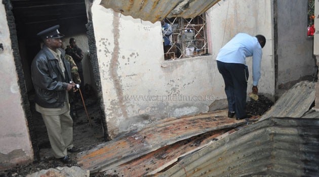 Police inspect the house where Owuor's parents met their death/CFM