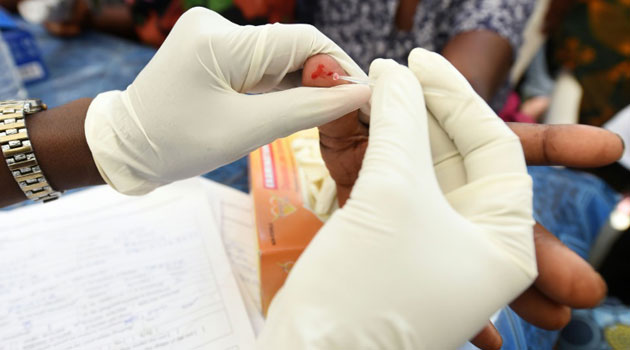 A health official tests for malaria, a disease that killed more than 400,000 people worldwide in 2015, with most of the deaths occurring in sub-Saharan Africa/AFP