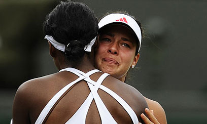 Williams sisters surge into Wimbledon quarters