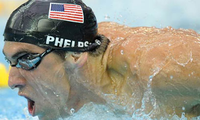 Phelps breaks 100m butterfly world record