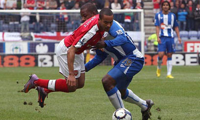 Gunners stunned by Wigan comeback