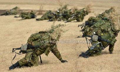 Japan changes rules to allow aid to foreign militaries