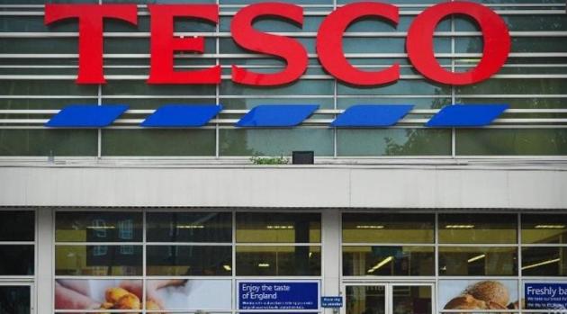 UK supermarket Tesco’s profit halves as inflation bites
