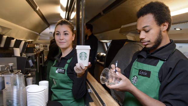 Starbucks boss plans more baristas and less tech