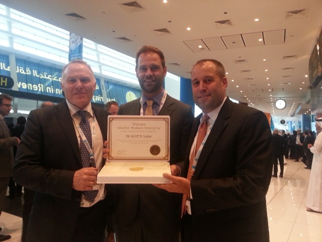 M-KOPA Solar Executive Chairman Nick Hughes with Jesse Moore Managing Director, and Chad Larson, Finance Director display the award certificate after winning in the SME Category of Zayed Future Energy Prize 2015. M-KOPA Solar was recognized for its ‘pay-as-you-go’ energy services for off grid customers that combine mobile payments with GSM sensor technology to enable the leasing of solar power systems.