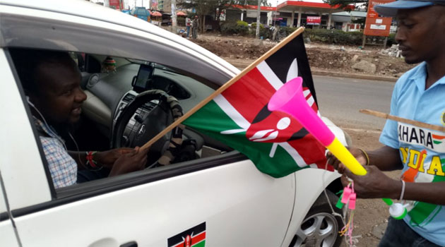 Kenyan flags on sale as presidential poll outcome eagerly waited