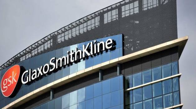 Drugmaker GSK says 2021 profits sink almost a quarter