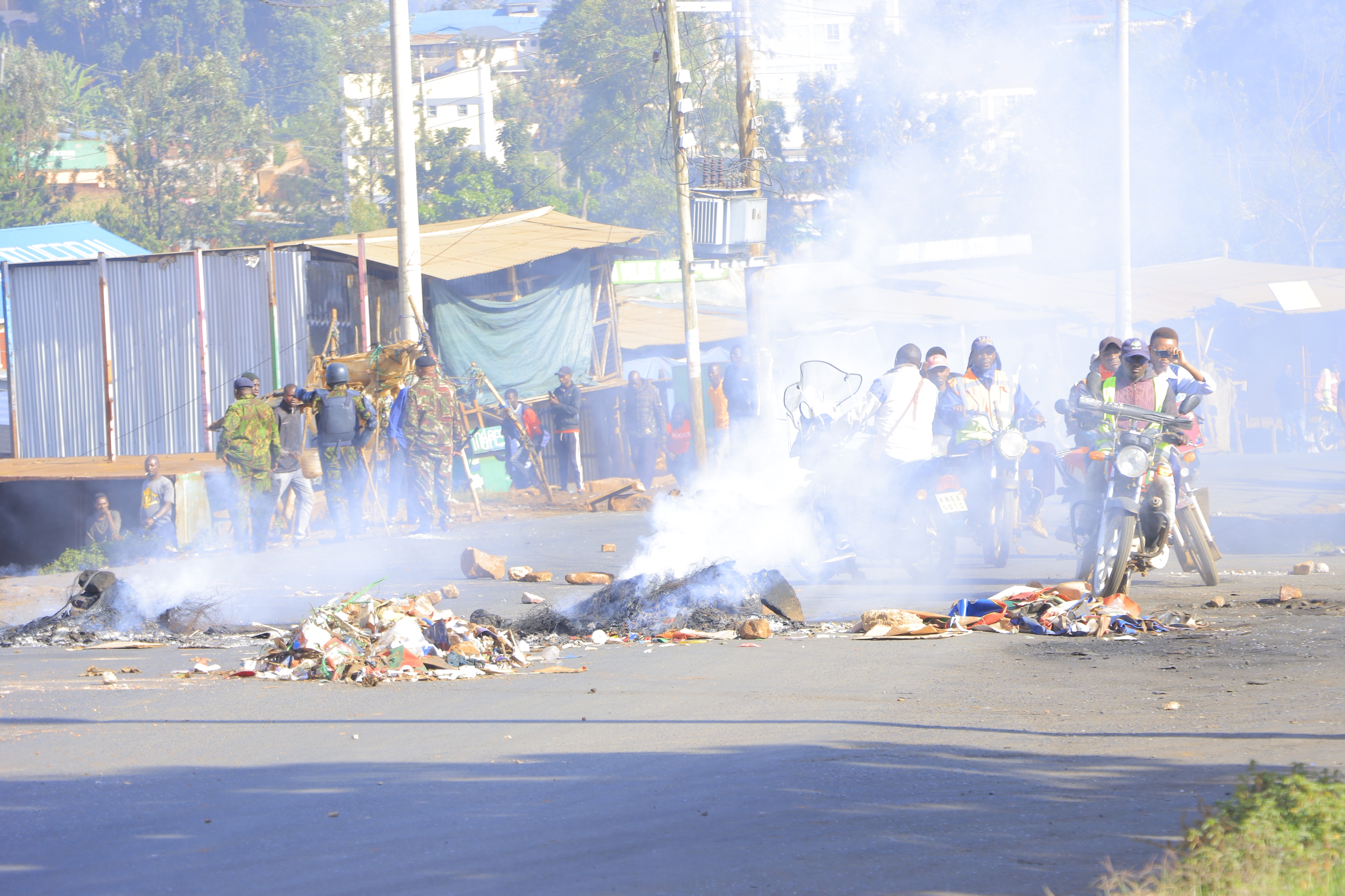 Protesters defy ban as police fire tear gas