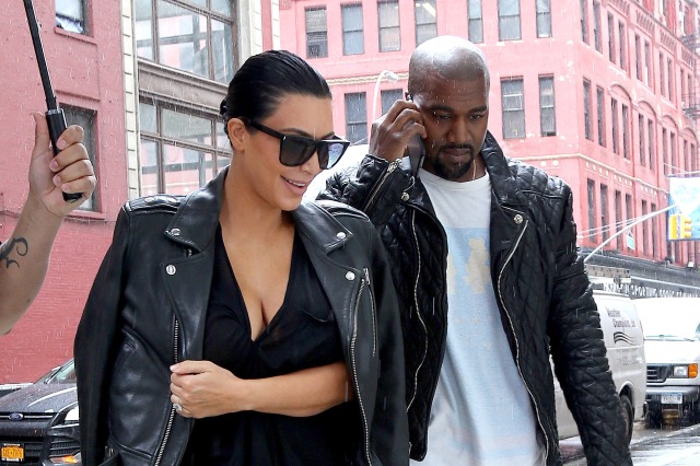 **USA ONLY** New York, NY - Kim Kardashian and Kanye West left their Soho apartment on Monday morning, bracing for the gloomy NYC weather. The pregnant reality star clutched her stomach as a bodyguard shielded her with an umbrella. Kim excitedly announced the pregnancy of her second child during a promo for the 'KUWTK' mid-season finale.  **USA ONLY** To License These Photos, Please Contact : Steve Ginsburg (310) 505-8447 (323) 423-9397 steve@akmgsi.com sales@akmgsi.com or Maria Buda (917) 242-1505 mbuda@akmgsi.com ginsburgspalyinc@gmail.com