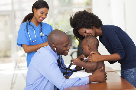 african mother and her son in doctor's office