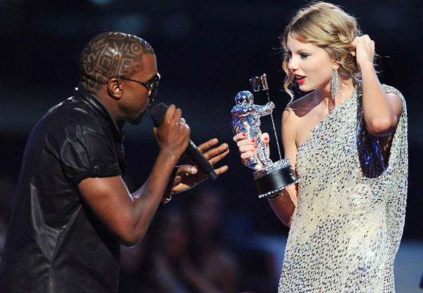 Kanye West takes the microphone from Taylor Swift and speaks onstage during the 2009 MTV Video Music Awards at Radio City Music Hall on September 13, 2009 in New York City. 2009 MTV Video Music Awards - Show Radio City Music Hall New York, NY United States September 13, 2009 Photo by Kevin Mazur/WireImage.com To license this image (16951148), contact WireImage.com