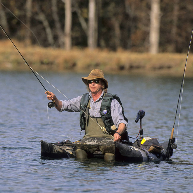 Fly fishing for trout, kick boating for stillwater trout, Drakensberg, KwaZulu-Natal, South Africa (via Nigel Dennis/Africa Imagery/africanpictures.net)