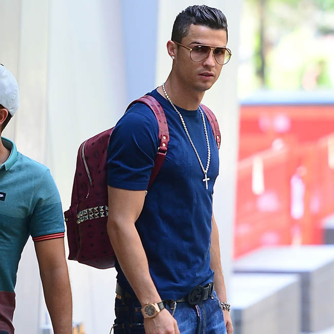 Cristiano Ronaldo and Girlfried Irina Shayk were spotted out in NYC on Sunday. Cristiano and a few friends headed to practice with his soccer team, while Irina went for a walk. She blew him a large kiss goodbye as they parted ways. She stunned in a black tee, jean short shorts and a vibrant blue purse. Pictured: Cristiano Ronaldo  Ref: SPL777487  080614   Picture by: 247PapsTV / Splash News Splash News and Pictures Los Angeles:	310-821-2666 New York:	212-619-2666 London:	870-934-2666 photodesk@splashnews.com 