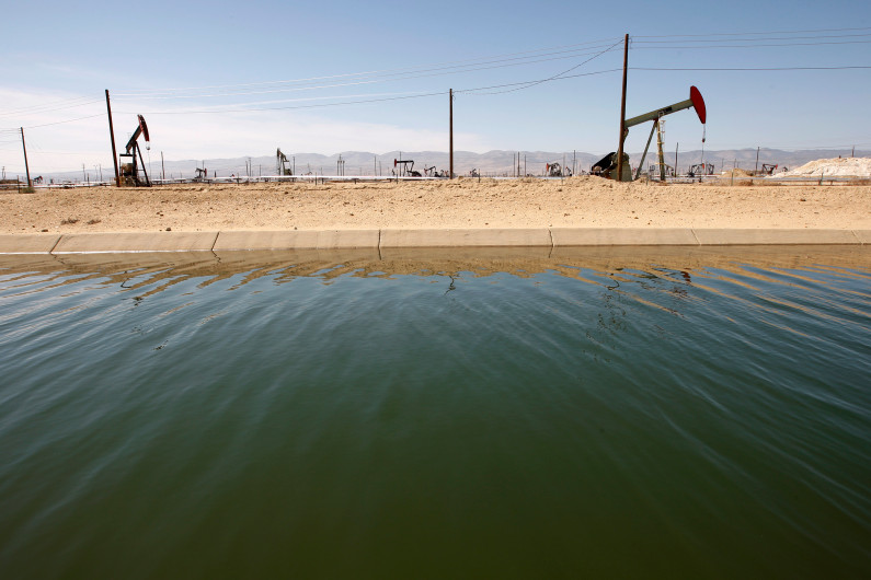 LOST HILLS, CA - MARCH 23:  Pump jacks are seen next to a canal in an oil field over the Monterey Shale formation where gas and oil extraction using hydraulic fracturing, or fracking, is on the verge of a boom on March 23, 2014 near Lost Hills, California. Critics of fracking in California cite concerns over water usage and possible chemical pollution of ground water sources as California farmers are forced to leave unprecedented expanses of fields fallow in one of the worst droughts in California history. Concerns also include the possibility of earthquakes triggered by the fracking process which injects water, sand and various chemicals under high pressure into the ground to break the rock to release oil and gas for extraction though a well. The 800-mile-long San Andreas Fault runs north and south on the western side of the Monterey Formation in the Central Valley and is thought to be the most dangerous fault in the nation. Proponents of the fracking boom saying that the expansion of petroleum extraction is good for the economy and security by developing more domestic energy sources and increasing gas and oil exports.   (Photo by David McNew/Getty Images)