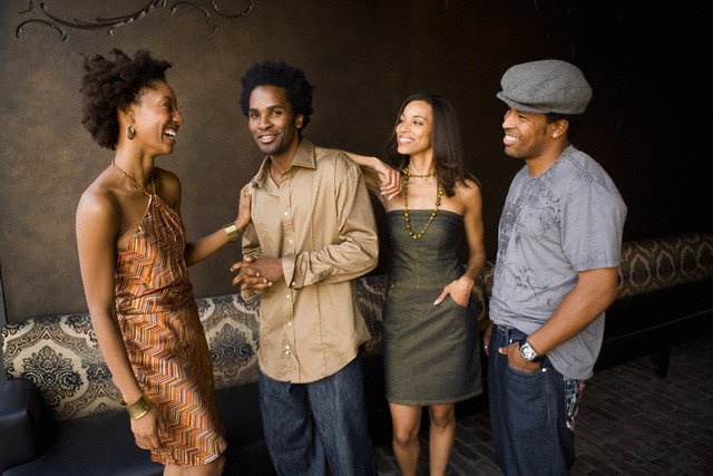 Friends hanging out in nightclub --- Image by © Ronnie Kaufman/Larry Hirshowitz/Blend Images/Corbis