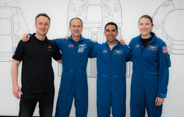 SpaceX capsule with crew of four docks with ISS
