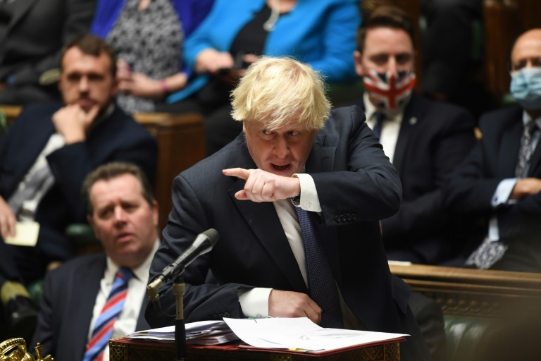 Nearly 100 Tory MPs rebel against Johnson’s new virus curbs