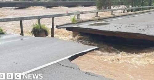 Major highway partly collapses as Australian floods worsen