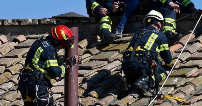 Vatican fire brigade erects iconic chimney to announce new Pope