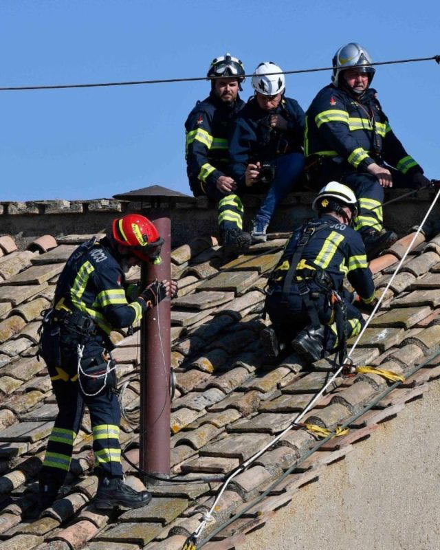 Vatican fire brigade erects iconic chimney to announce new Pope