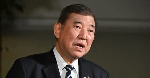 Japan’s PM vows to stay on despite bruising election loss