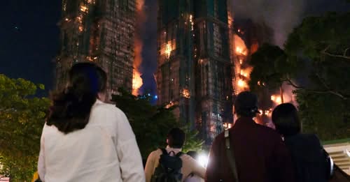 At least 44 dead and hundreds missing after fire engulfs Hong Kong tower blocks