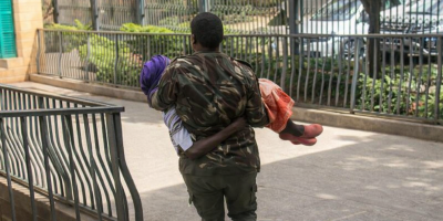 Footage shows police officer carrying 105-year-old woman to Nairobi courtroom amid missing file puzzle