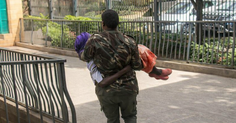 Footage shows police officer carrying 105-year-old woman to Nairobi courtroom amid missing file puzzle