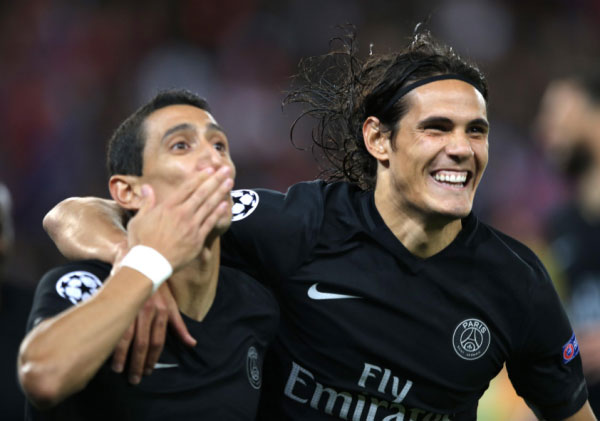 PSG's Angel Di Maria, left, and PSG's Edinson Cavani react after di Maria scored the opening goal during the Champions League Group A soccer match between PSG and Malmo at the Parc des Princes stadium in Paris, France, Tuesday, Sept. 15, 2015. PHOTO/AP/Yahoo!
