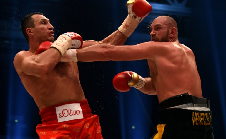 Tyson Fury (R) was awarded the fight in Duesseldorf 115-112, 115-112 and 116-111 by the judges as Wladimir Klitschko's reign as world heavyweight champion was ended after nine years, six months. PHOTO/AFP