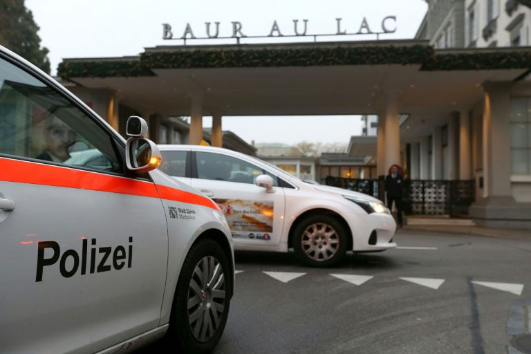 A police car pictured in front of the entrance of the Hotel Baur au Lac in Zurich December 3, 2015, where Swiss authorities have conducted an early-morning operation to arrest several FIFA football officials The Swiss government said two FIFA officials were detained in Zurich on December 3 ,confirming reports of newarrests in the broadening FIFA scandal, and said they were suspected of accepting millions of dollars in bribes. PHOTO/AFP