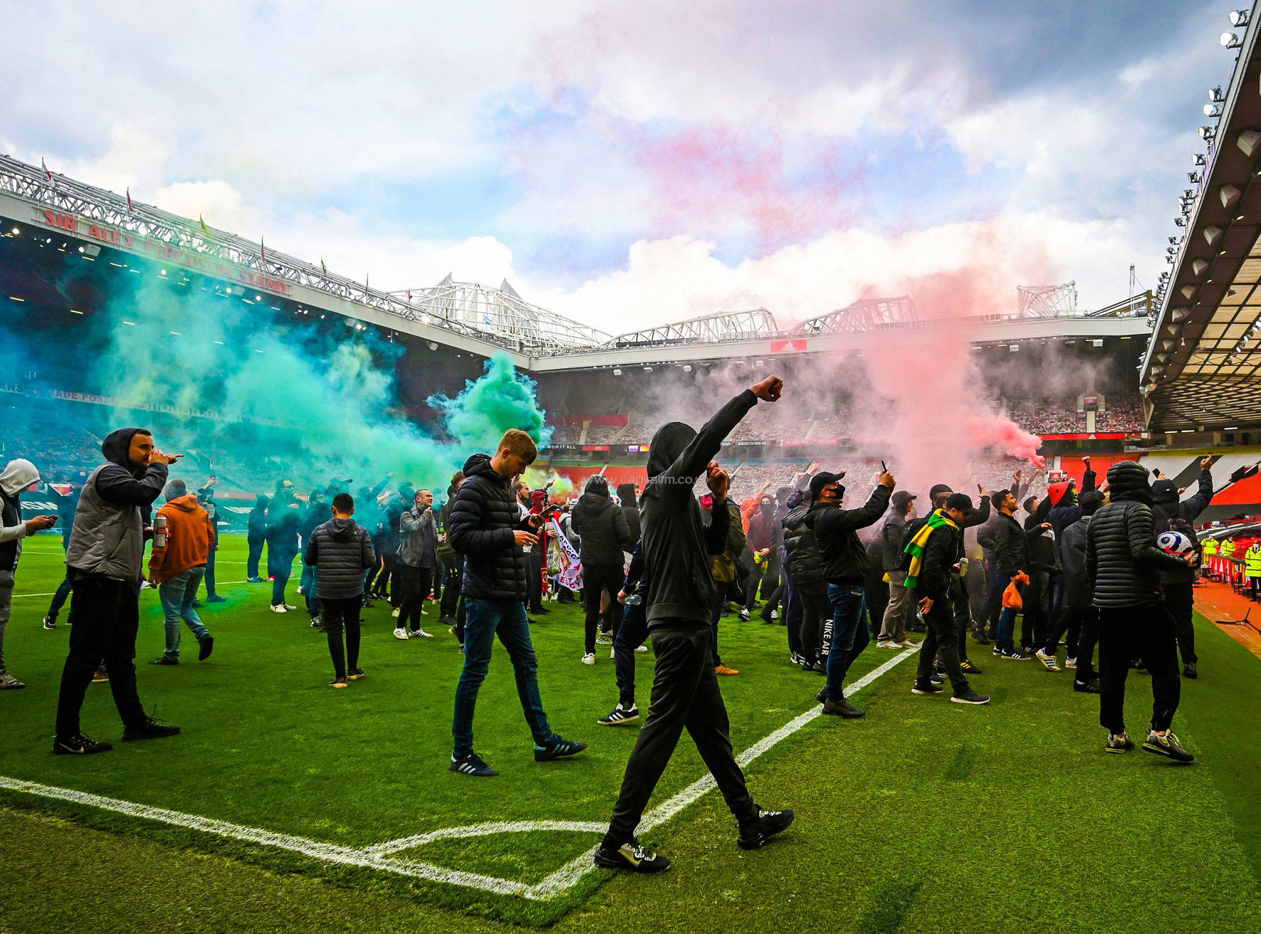 Man Utd fans storm Old Trafford pitch in anti-Glazer protest