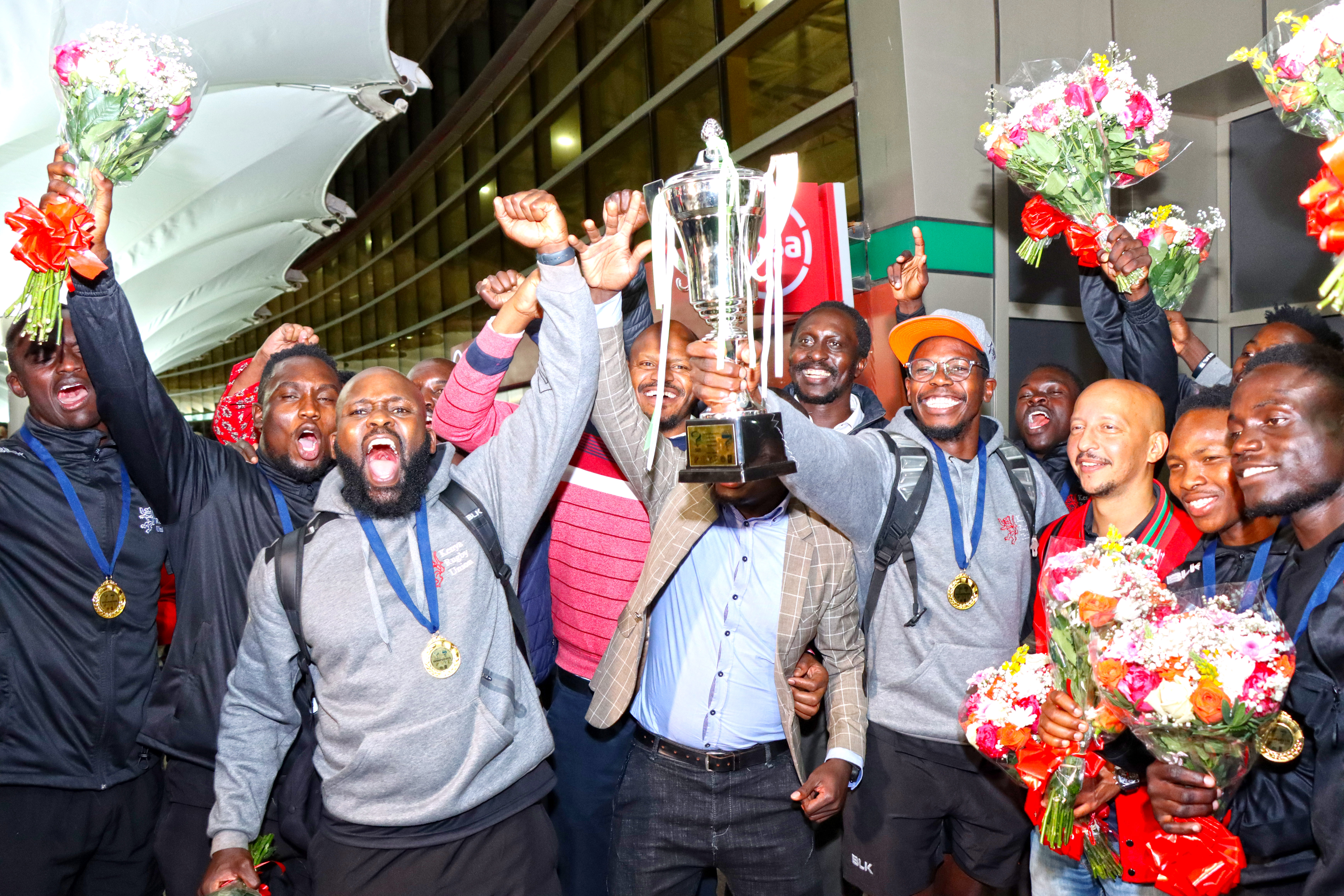 Olympics-bound Shujaa bring JKIA to life as they jet back from Harare