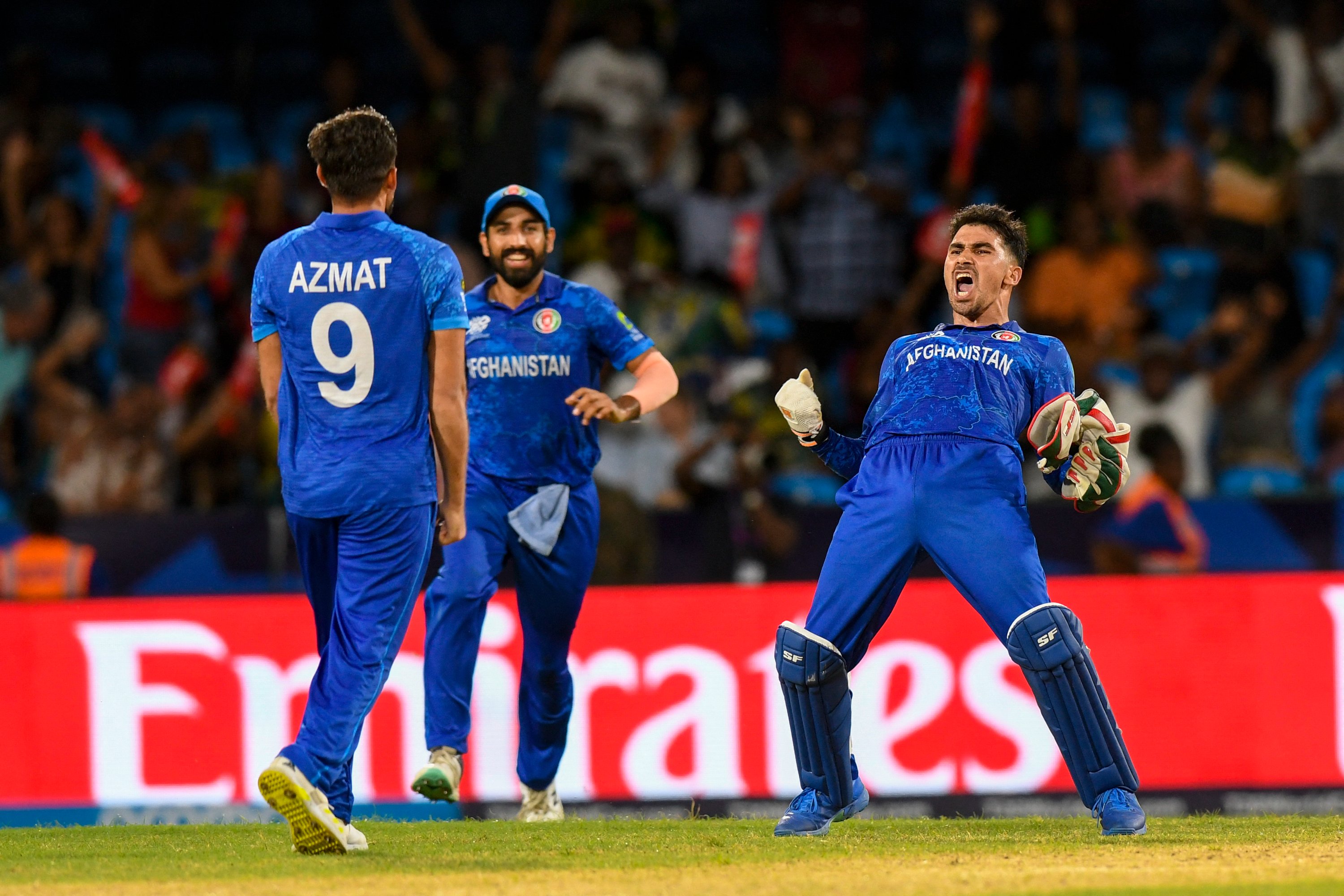 Afghanistan shock Australia to keep semi-final hopes alive