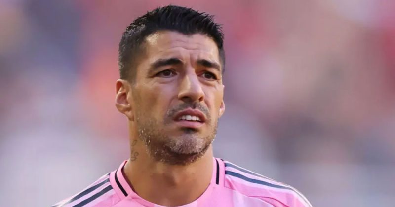 Controversial Suarez sorry for spitting at opposition coach